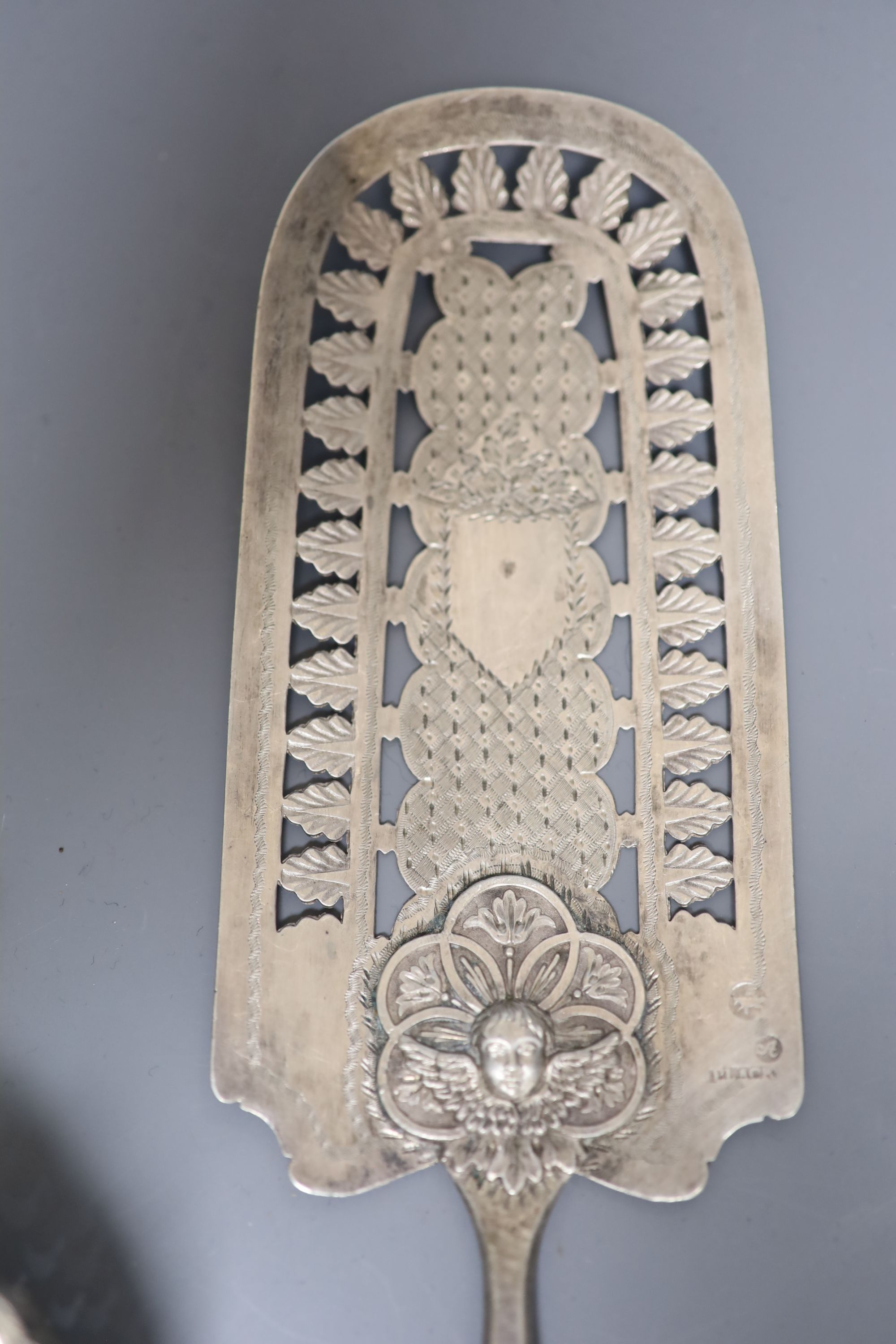 A continental pierced white metal cake slice and two other items including plated candle snuffer.